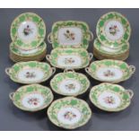 A mid-19th century English porcelain dessert service with green & gilt vine decoration to the wide