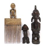 A Suku carved wood male standing figure with stylised coiffure, 7¾” high; a small Zande carved