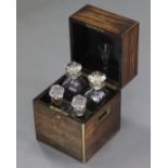 A 19th century coromandel rectangular decanter box with brass-mounted edges, hinged lid, & Bramah