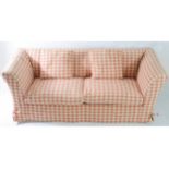 A CONRAN ‘REX’ THREE-SEATER SOFA-BED upholstered cream fabric & covered in chequered cream &