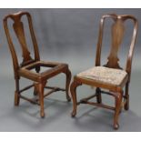 A pair of Queen Anne-style walnut side chairs with shaped splat backs, padded drop-in seats, & on