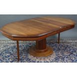 An “ESIGENCE” (Made in France) cherry wood octagonal extending dining table with two additional