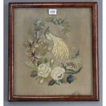 An early 19th century needlework picture of a bird amongst flowers; 15” x 13”, in glazed frame.