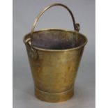 A late 19th/early 20th century brass bucket with swing overhang handle & shield-shaped mounts, 11.5"