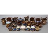 A collection of fifteen various Victorian copper lustre jugs with coloured enamel and/or raised