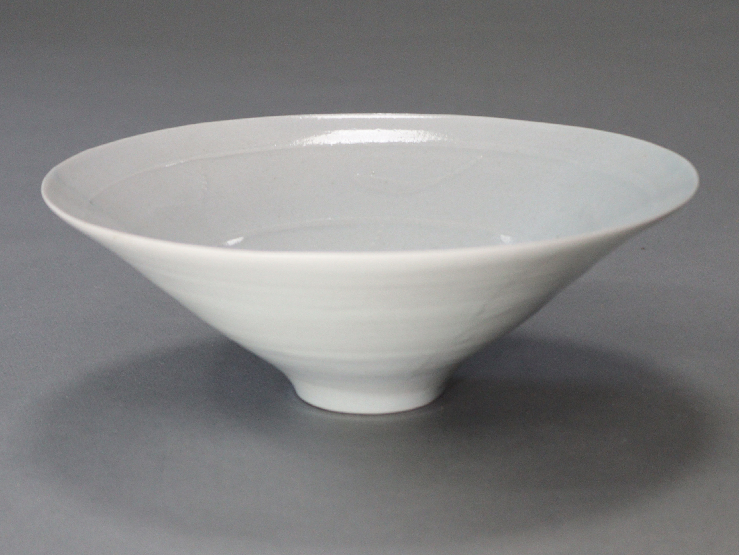 DAVID LEACH (1911-2005). A finely potted porcelain bowl of off-white glaze, with funnel-shaped