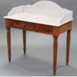 A Victorian mahogany washstand with rectangular marble tray-top above two frieze drawers with turned