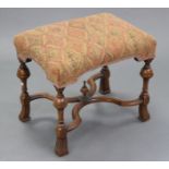 A William & Mary style carved walnut rectangular stool, with padded seat upholstered geometric