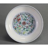 A Chinese porcelain saucer dish painted with phoenix amongst scrolling flowers to the centre &