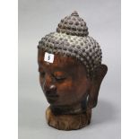 A bronzed Buddha head ornament, 12½” high.