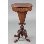A Victorian mahogany needlework table, the crossbanded octagonal top enclosing numerous