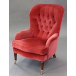 A regency-style armchair with buttoned back & sprung seat upholstered coral-pink velour, & on turned