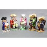 A collection of five Victorian Staffordshire pottery Toby jugs, three standing & two seated, the