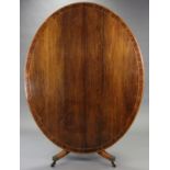 A REGENCY INLAID ROSEWOOD OVAL TILT-TOP DINING TABLE, with wide crossbanding to the figured top,