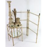 A small gold-painted bow front side table, with pierced scroll sides & inset mirrored top &