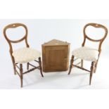 A pair of late Victorian balloon-back bedroom chairs with padded seats & on turned supports;