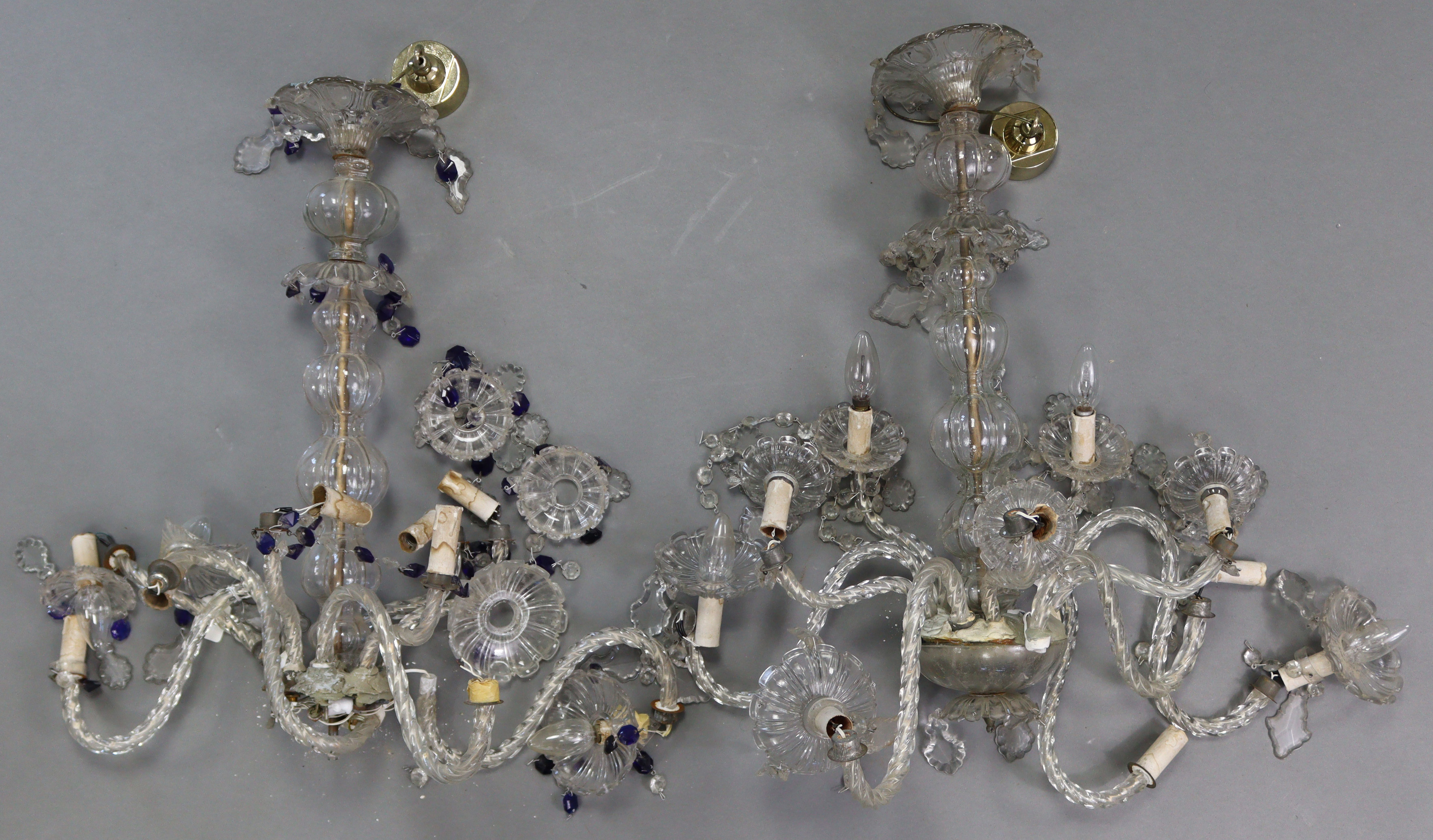 A pair of glass eight-branch chandeliers hung with prism drops & strands-of-beads, 20” wide x 31”