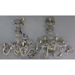 A pair of glass eight-branch chandeliers hung with prism drops & strands-of-beads, 20” wide x 31”