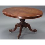 A mid-Victorian mahogany tilt-top oval centre table, with moulded edge, on bulbous carved centre