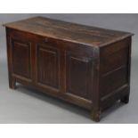 A late 17th/early 18th century oak & elm coffer, the triple panel front inscribed: “D. E. 1720”,
