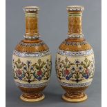 A pair of Mettlach (Villeroy & Boch) stoneware vases of ovoid form with straight narrow necks,