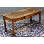 A 19th century French chestnut farmhouse dining table, the rectangular top with cleated ends, fitted