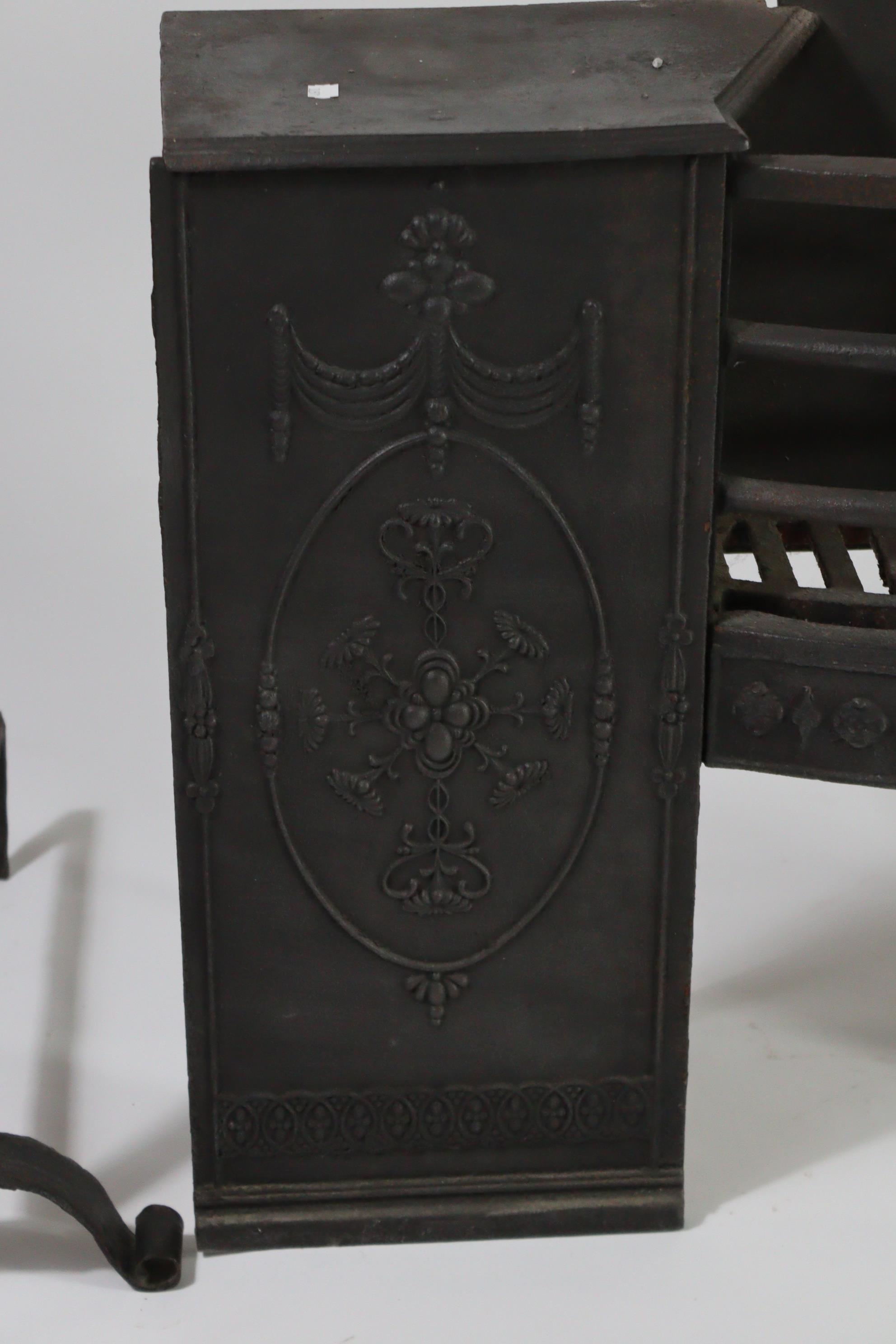 A cast-iron fire grate with Adam-style relief decoration, 35” wide x 24½” high; together with a pair - Image 3 of 4