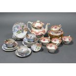 A mid-19th century English porcelain teapot & six matching cups & saucers with pink floral