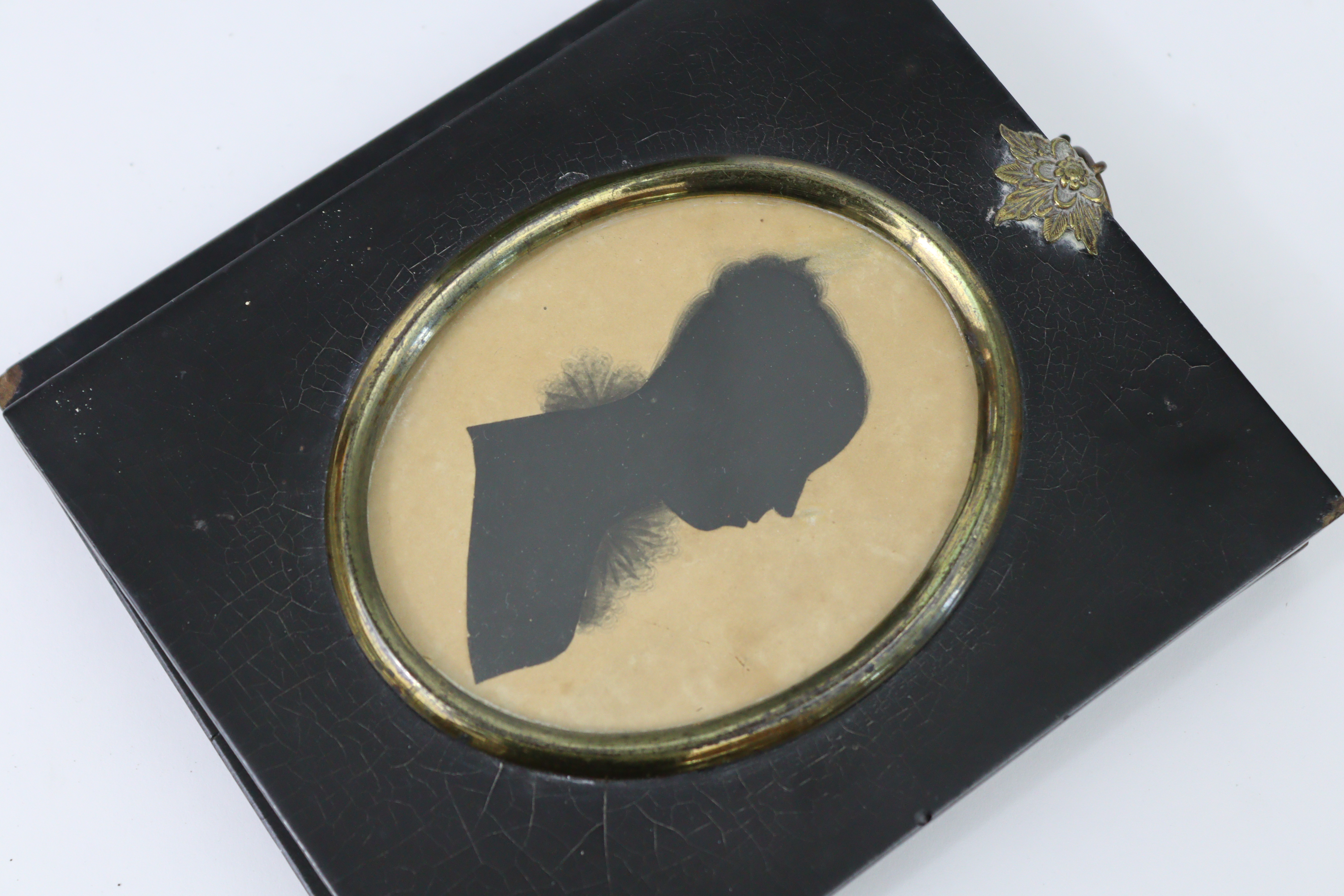 A 19th century miniature oval silhouette female portrait study titled to reverse “Elizabeth Nelson”; - Image 2 of 3