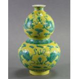 A CHINESE PORCLEAIN YELLOW-GROUND DOUBLE GOURD-SHAPED VASE with incised & green enamel decoration of