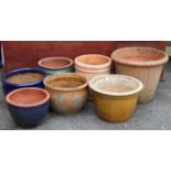 Five various terracotta garden pots; & two glazed ditto.