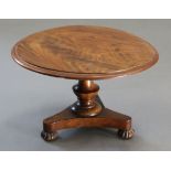 A 19th century 'apprentice-piece' figured mahogany centre table, the circular top with moulded edge,
