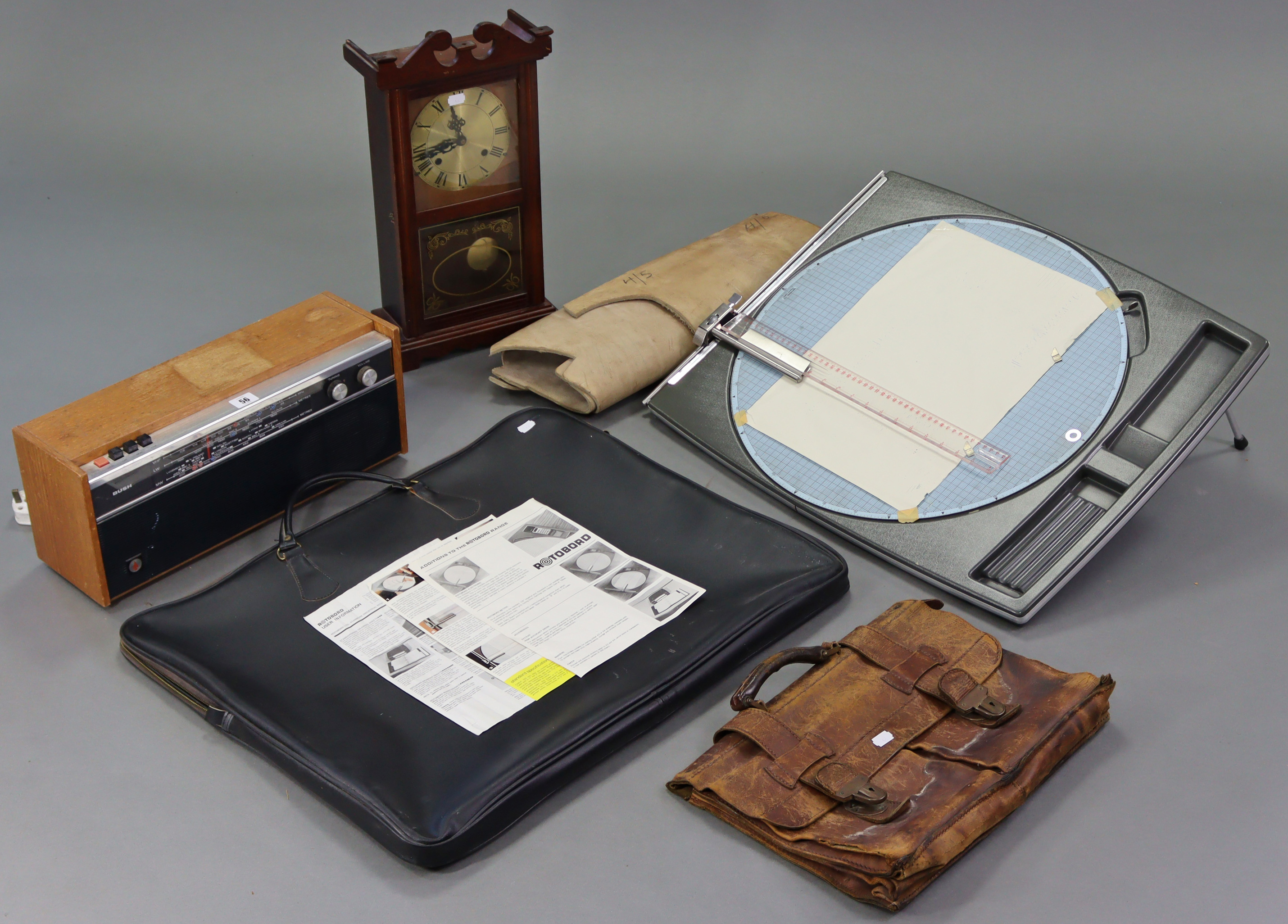 A “Rotobord” with case; together with a Bush radio (Type VHF 101); a mantel clock; a leather