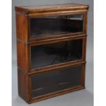 A Globe Wernicke-type oak three-tier sectional bookcase, each tier enclosed by glazed door, 34” wide