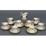 Eight Coalport Harlequin “Bat’s-Wing” coffee cups & saucers; & a ditto cream jug.