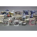 A collection of sixteen various 19th century Staffordshire pottery jugs, mugs, loving cups, etc. (