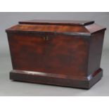 An early 19th century mahogany cellarette of sarcophagus shape, with hinged lift-lid & lead lined