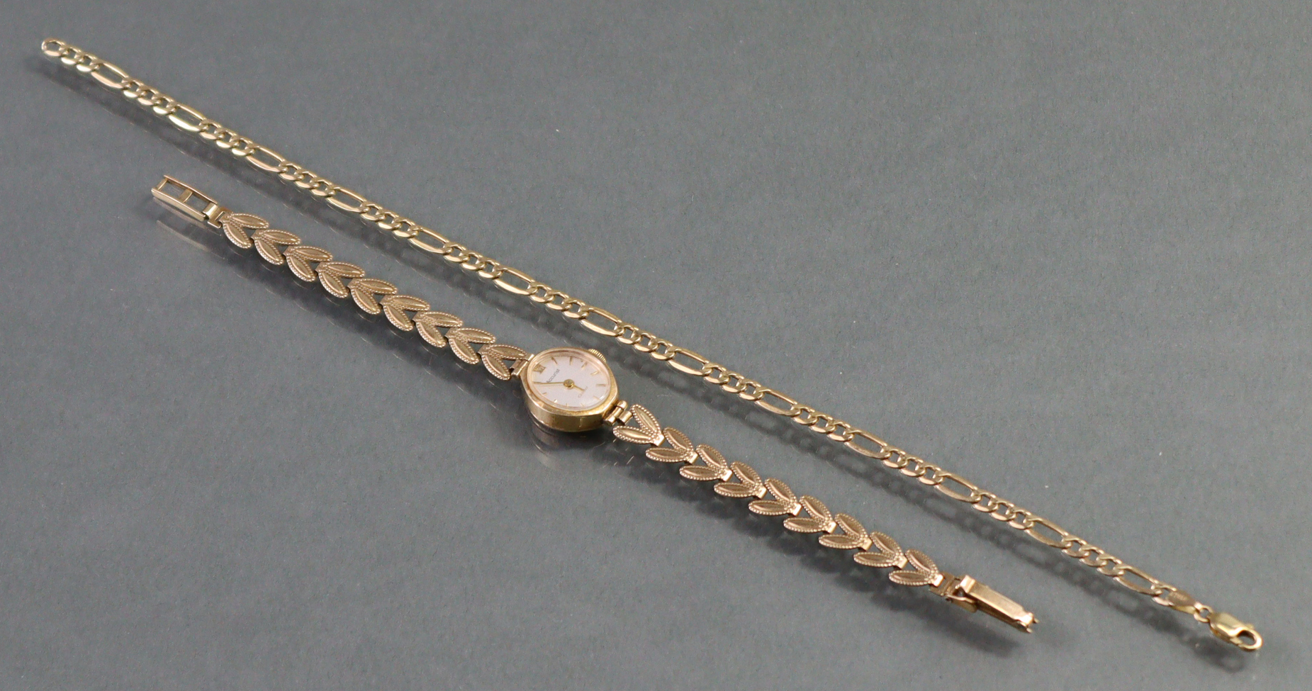An Accurist 9ct. gold ladies’ wristwatch, the oval silvered dial with gold baton numerals & roman - Image 2 of 6