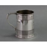 An Edwardian silver mug of tapered form with reeded bands, engraved initials & date July 29th