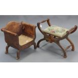 A small brass-studded leather covered occasional chair with shaped back & scroll arms (lacking