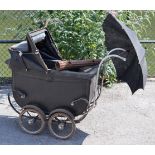 An early-mid 20th century Lines Bros. “Pedigree” coach built pram (black), with 11½” diam. spoke