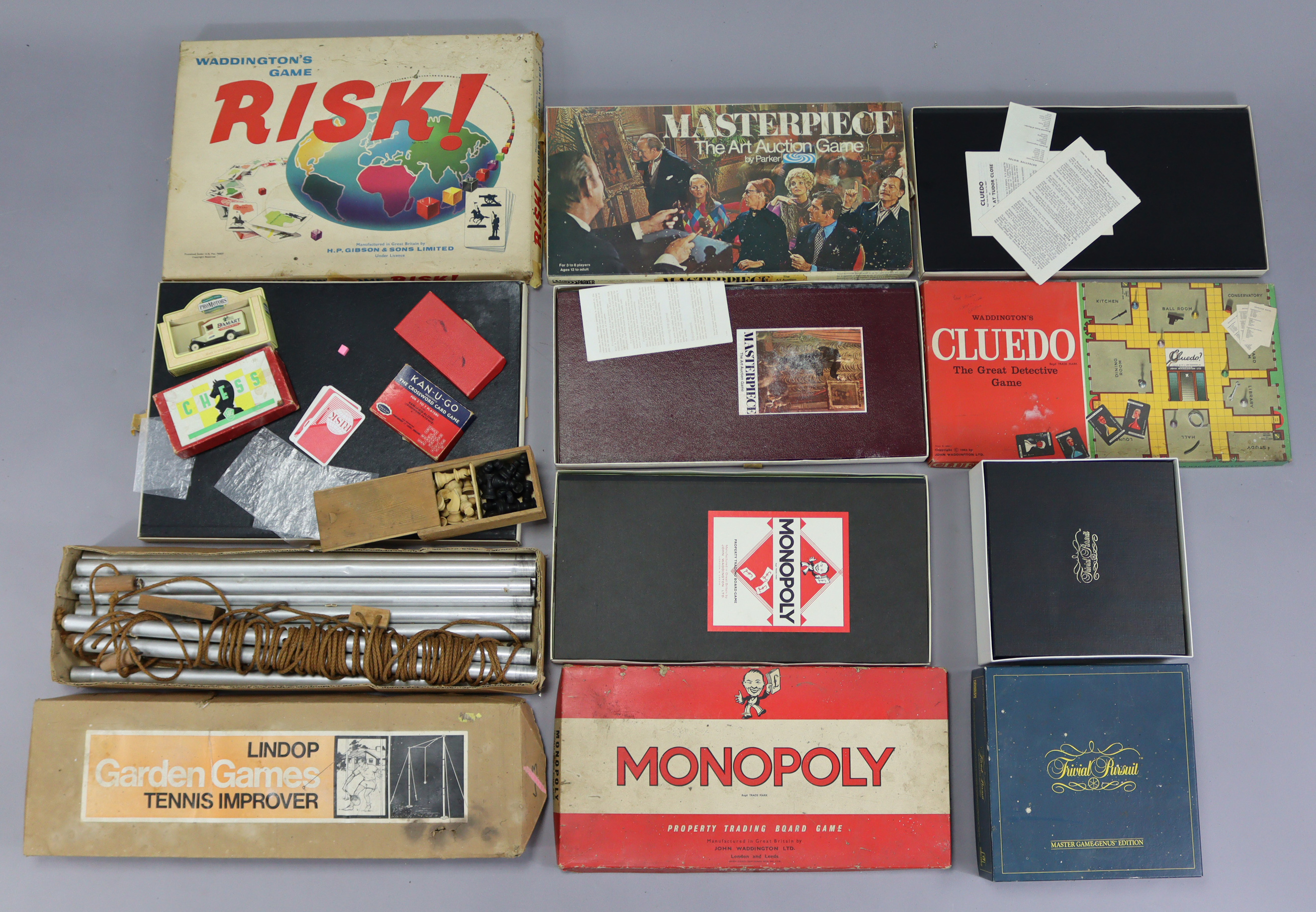 A LINDOP GARDEN GAMES “TENNIS IMPROVER”, boxed; together with various board games; & a carved wooden