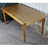 A pine refectory-style dining table with plain rectangular top & on four turned legs; 71¼” x 35”.