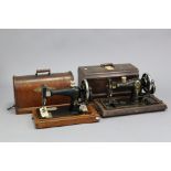 A Singer hand sewing machine in walnut dome-top case (decoration worn); & an Ancos ditto.