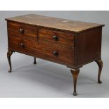 A mahogany low chest with plain rectangular top, fitted two short & one long drawer with turned
