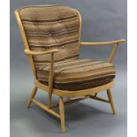 An Ercol light elm open armchair with removable padded seat & back.