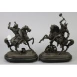 A pair of spelter fighting figures on horseback, each with a shield in one hand & a weapon raised