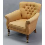 A Victorian-style armchair with rounded buttoned back, padded scroll arms, & sprung seat upholstered