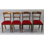 A matched set of four mahogany bow-back dining chairs with padded seats & turned front legs.