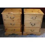 A pair of pine bedside chests, each fitted three drawers with brass swan-neck handles & shaped